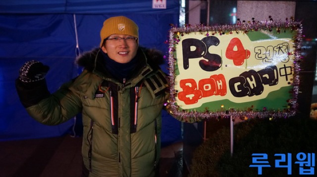 Husband And Wife Freezing Their Butts Off For A PS4 Is Heartwarming