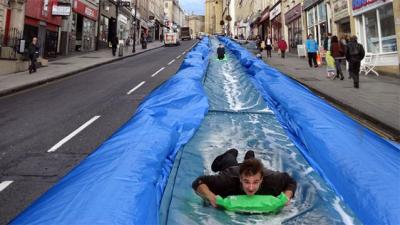 Help A Man Build A 300-Foot Water Slide In The Middle Of A Road