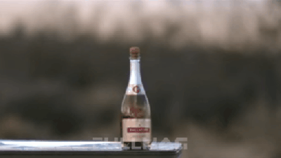 Uncorking A Champagne Bottle With A Huge Sniper Rifle