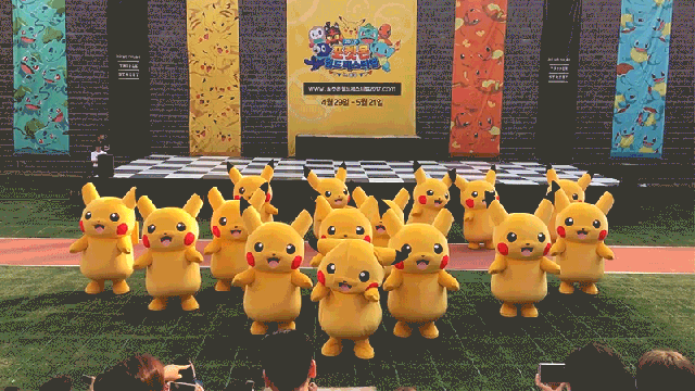 Rapidly Deflating Pikachu Rushed To Safety By Small Horde Of Suited Men