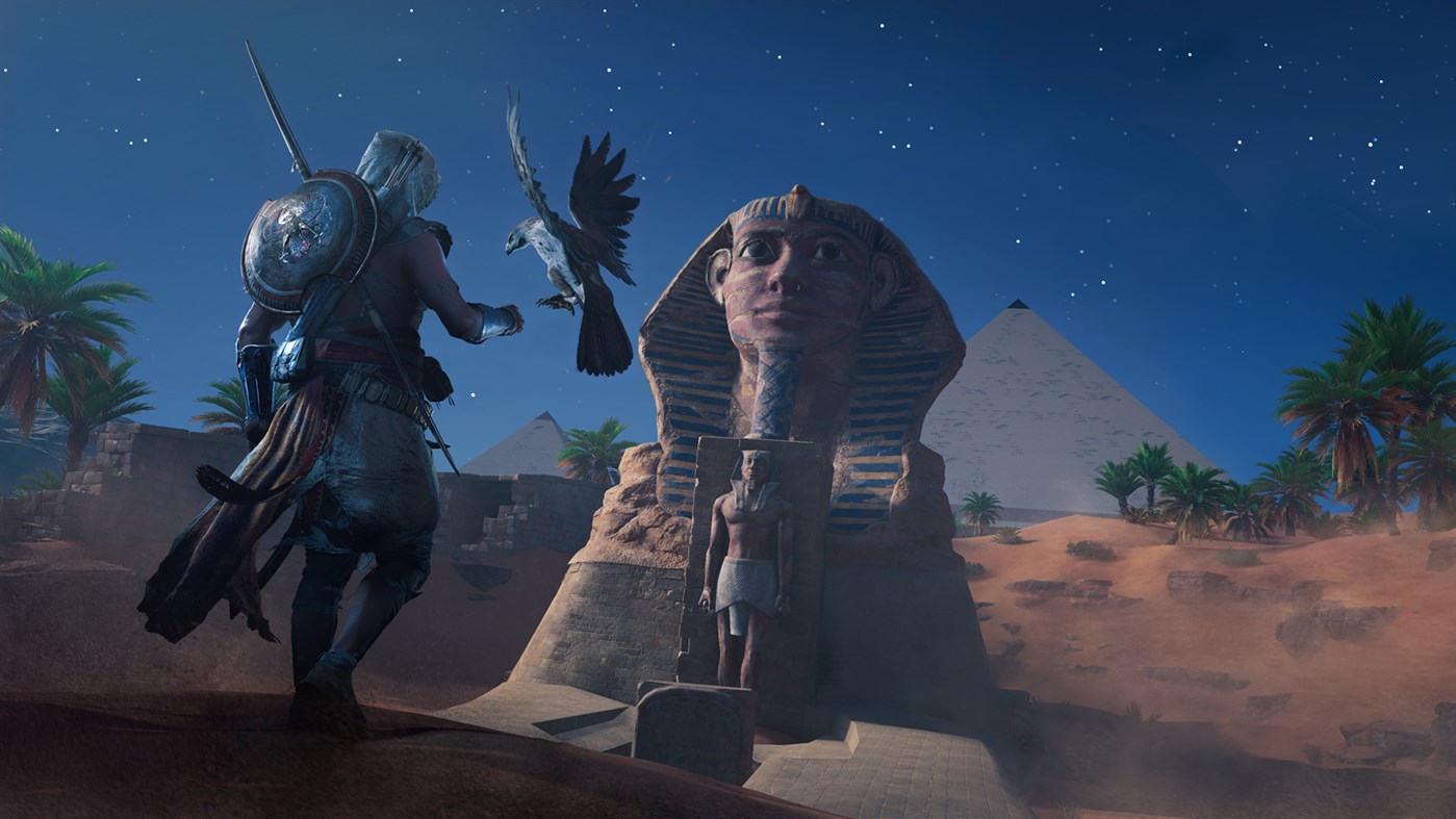 Bayek and his faithful eagle, Senu, standing in front of the Great Sphinx of Giza. (Screenshot: Ubisoft)