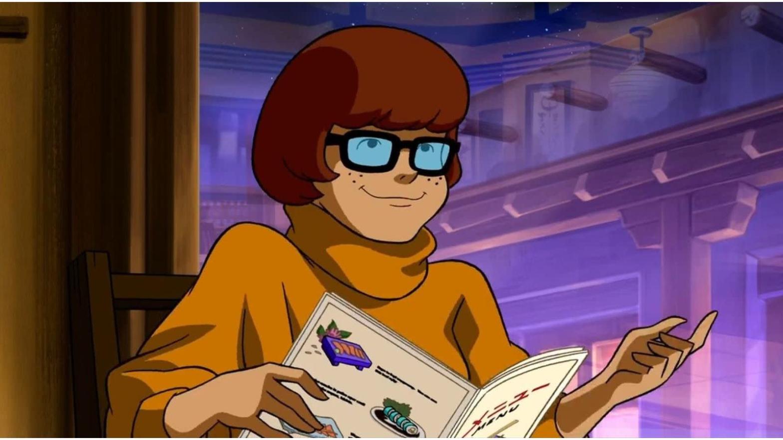 Velma, in a rare moment of not pulling a rubber mask off someone's head. (Image: WB Animation)