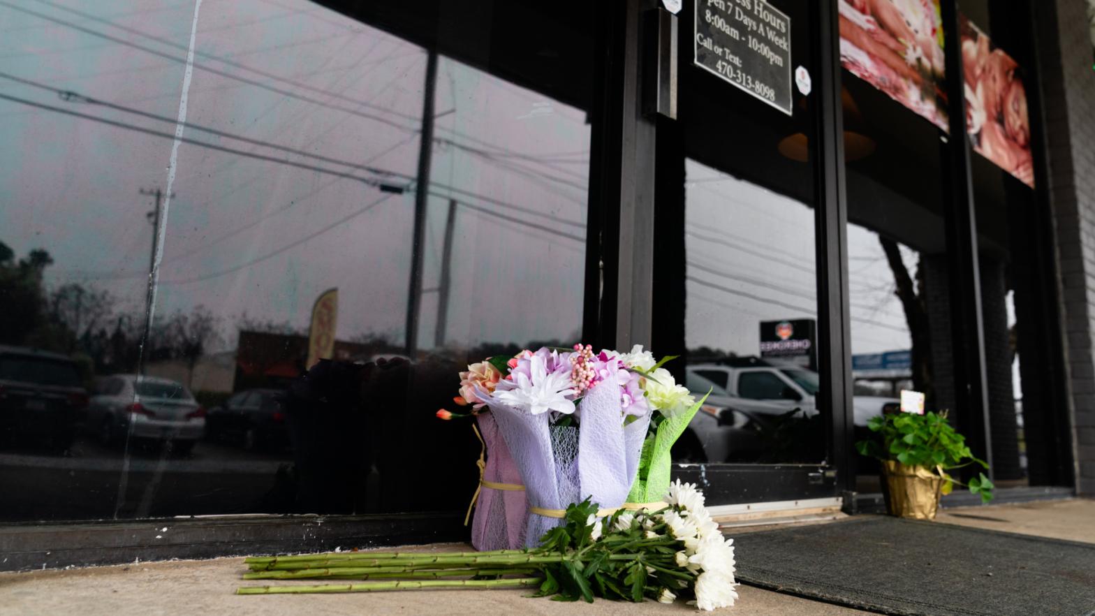 Flowers left outside the scene of the shooting that left four dead in Atlanta, Georgia. (Photo: Elijah Nouvelage, Getty Images)