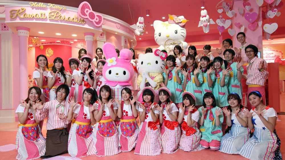 Staff at Hello Kitty's Kawaii Paradise in Tokyo pose for a photo.  (Photo: STR/AFP, Getty Images)