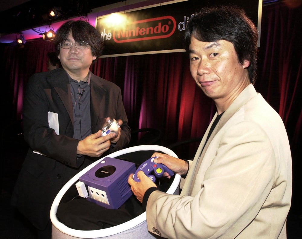 Shigeru Miyamoto and Satoru Iwata showed off the GameCube in Los Angeles in May 2001. (Photo: LUCY NICHOLSON/AFP, Getty Images)