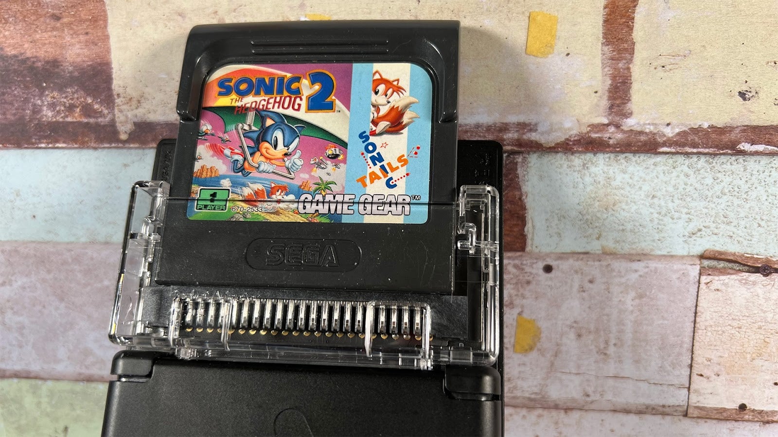 Game Gear cartridges pop up past the top of the unit while inserted.  (Photo: Mike Fahey / Kotaku)