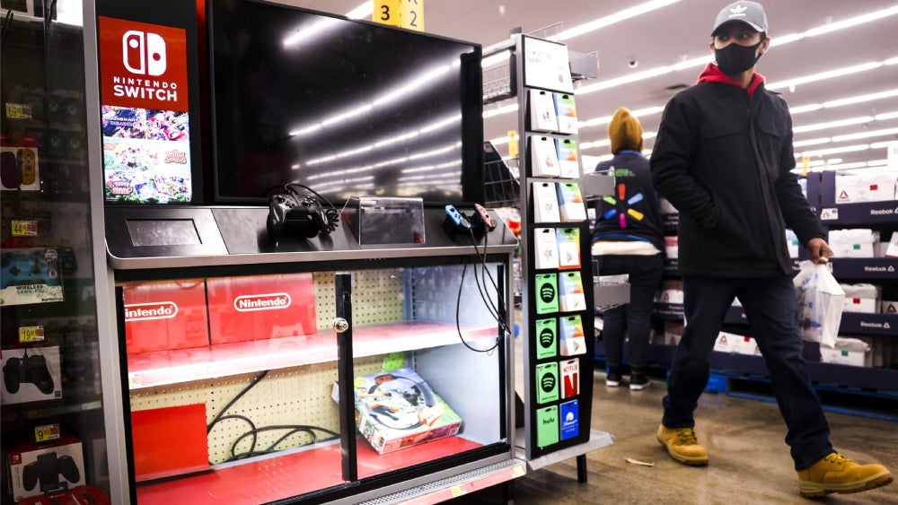 A customer passes a cleaned out Switch cabinet during last year's Black Friday sales.  (Photo: Michael Ciaglo, Getty Images)