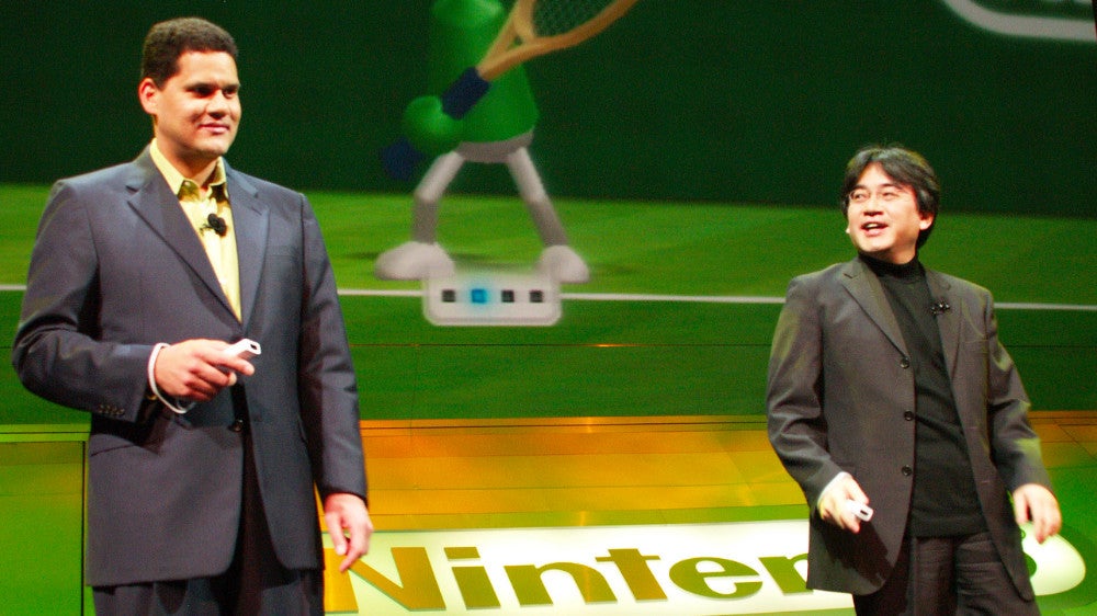 Reggie and Iwata on stage at Nintendo's 2006 E3 press conference.  (Photo: Michael Tran/FilmMagic, Getty Images)
