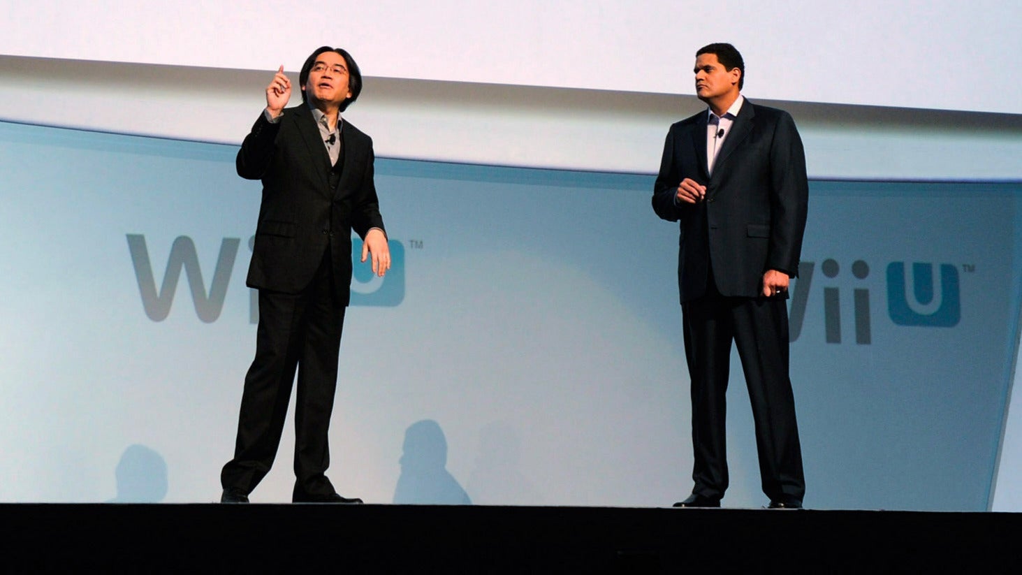 Iwata and Reggie speak on stage at the 2011 E3 gaming expo.  (Photo: Kevork Djansezian, Getty Images)