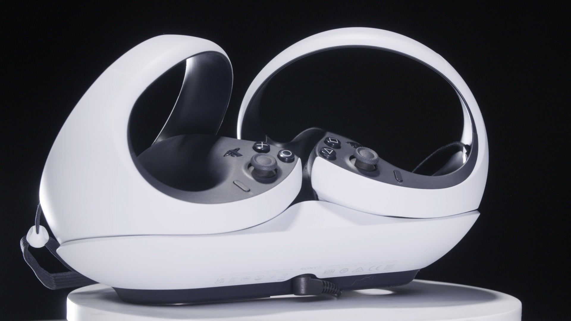 The charging cradle (sold separately) is a must-buy for PS VR2. (Photo: Kotaku)