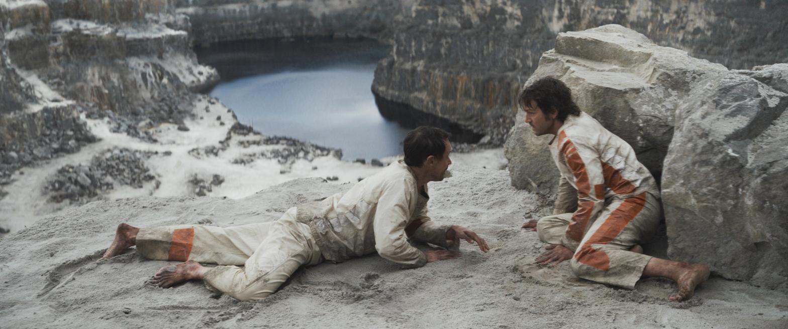 Melshi (Duncan Pow) and Cassian Andor (Diego Luna) confer on Andor. (Image: Lucasfilm/Disney+)