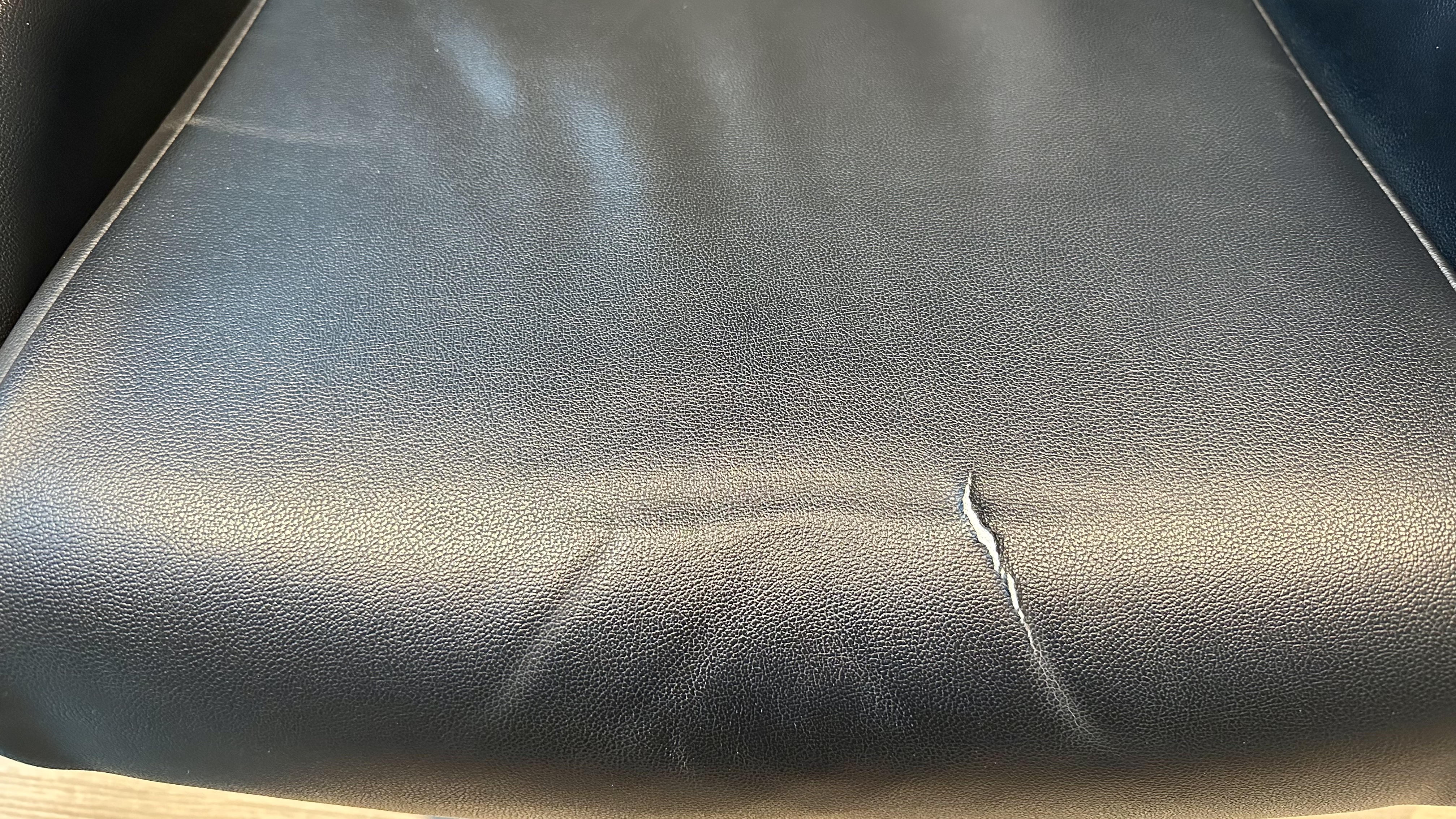 A cracked gamer chair seat